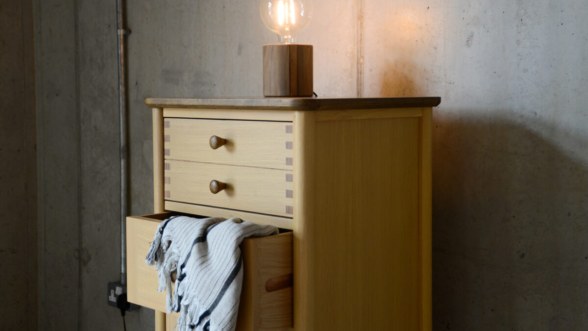 Two Tone Tallboy chest side with light and blanket