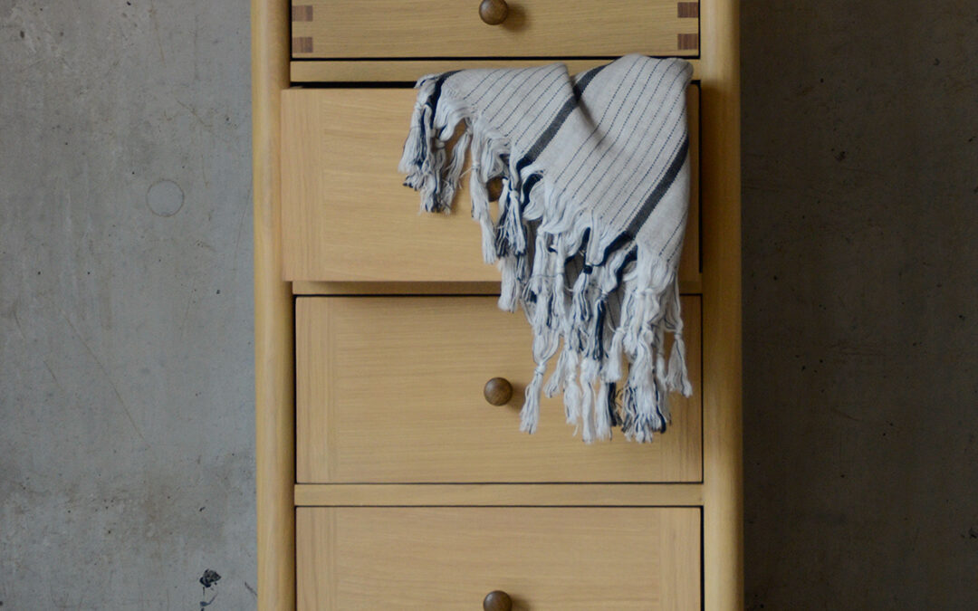Two Tone Tallboy chest side with light and blanket PORTRAIT