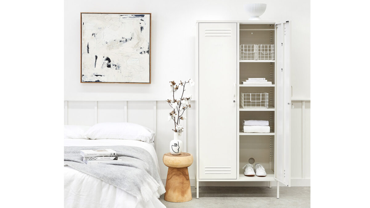 wardrobe storage locker in white shown with one door open