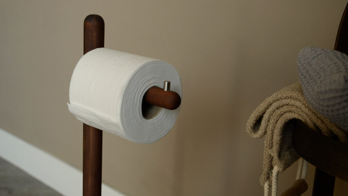 walnut free-standing loo roll holder shown close up