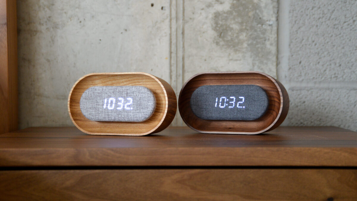 wooden alarm clocks on bedside table.