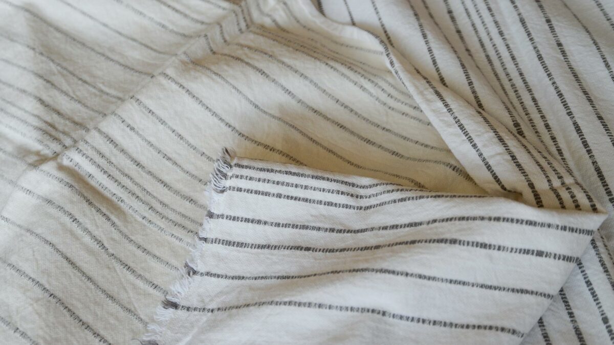 Jacquard weave white cotton throw with stripe in charcoal grey