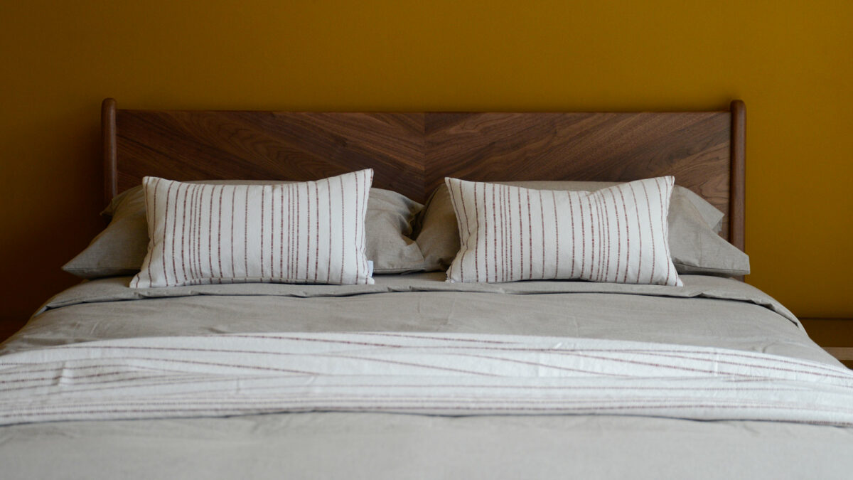 Jacquard weave white cotton cushions and matching throw with stripe in terracotta