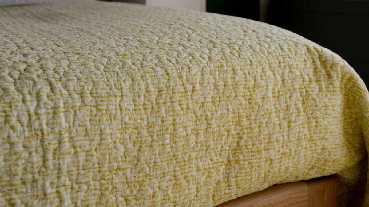 reversible bedspread in yellow and ivory