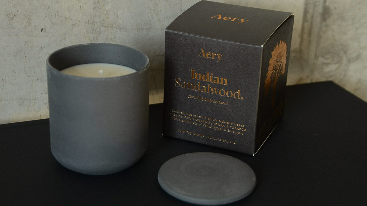 luxury gift-boxed Indian Sandalwood scented candle in a matt grey clay pot with lid