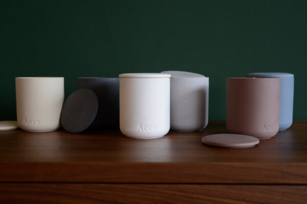 luxury scented candles in matt porcelain pots with lids in a range of scents and colours