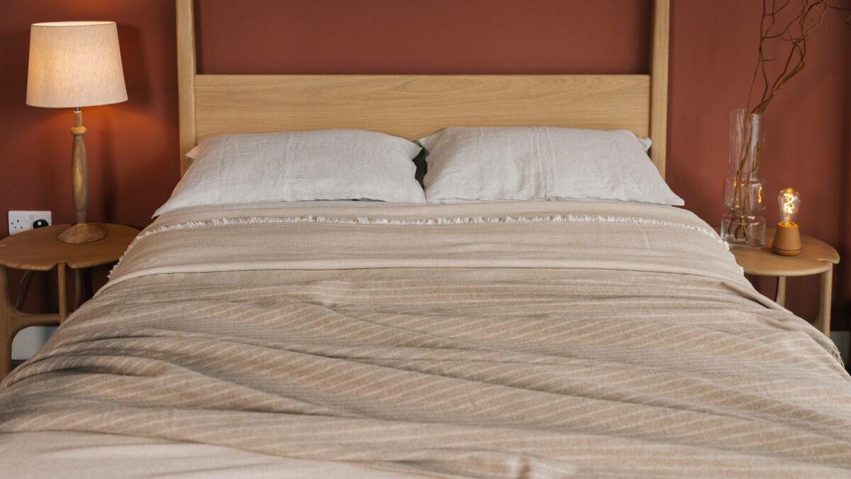alpaca blend striped throw with beige organic bedspread