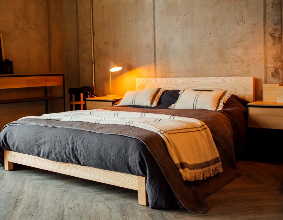 boho bedding on the Sonora low wooden bed for a contemporary Nordic look