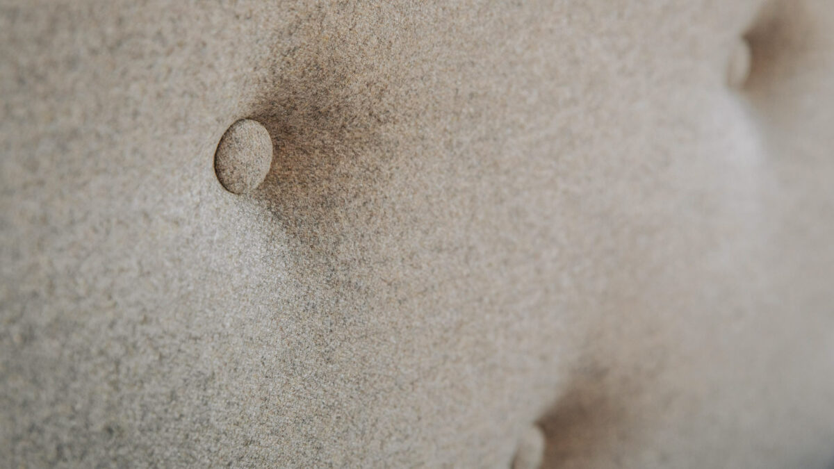 amamtheon linen buttoned headboard detail
