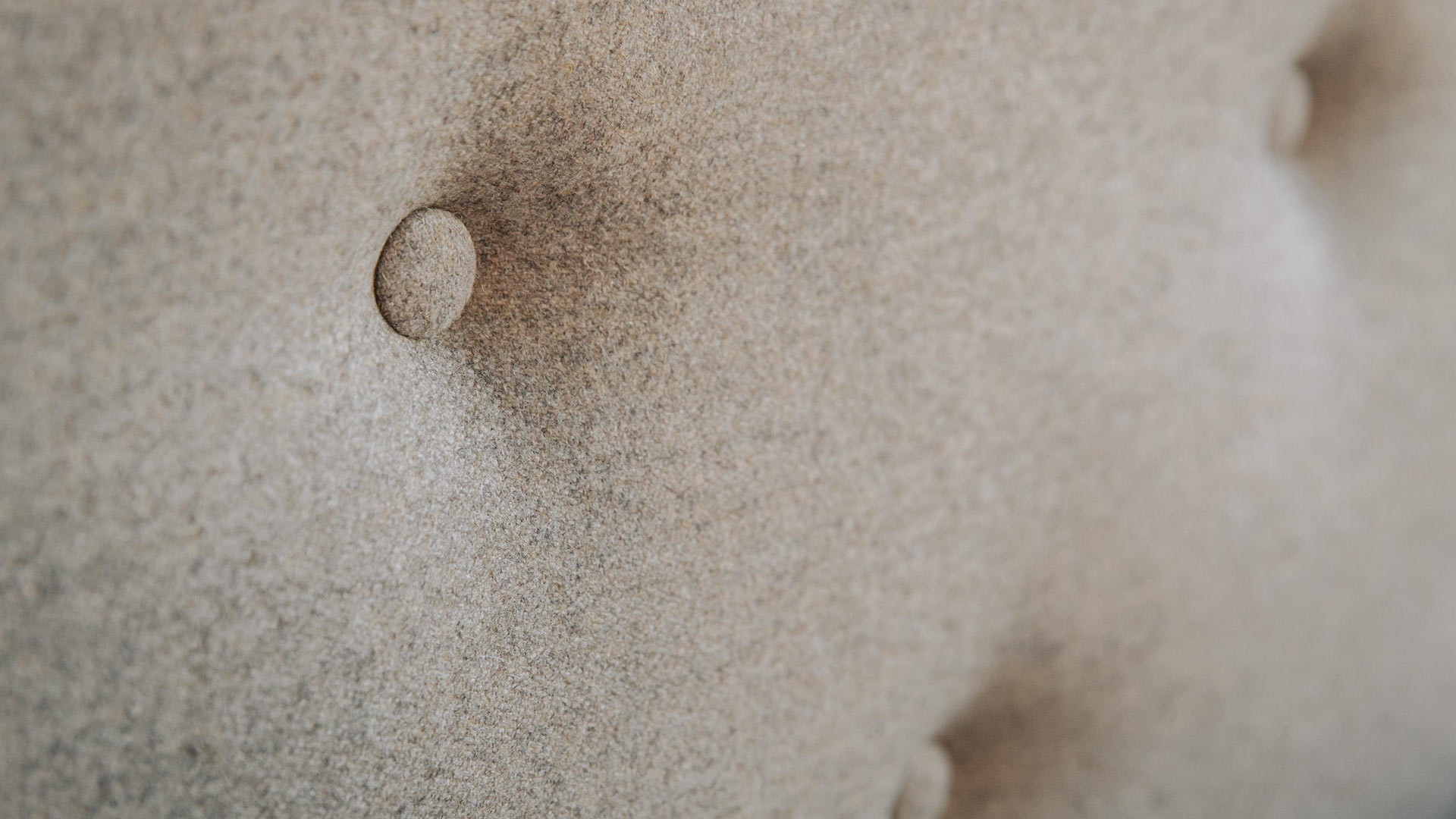 Close-up of the buttoned padded Bloomsbury bed headboard