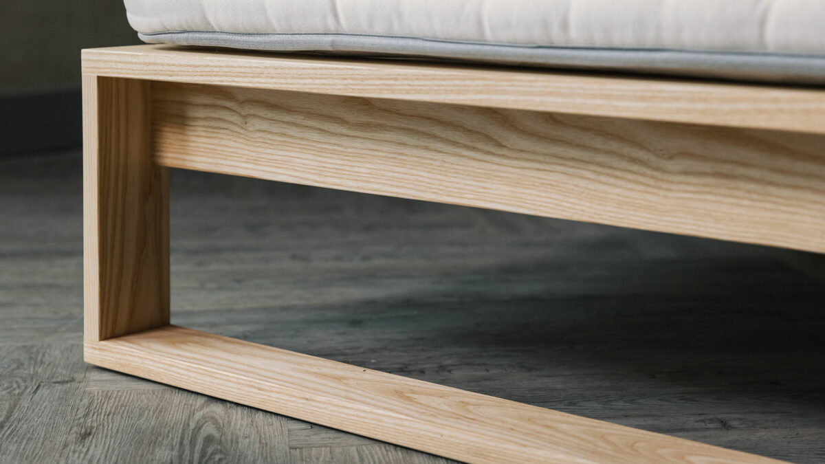 A special edition Leith bed in Ash wood a close up look at the foot end leg