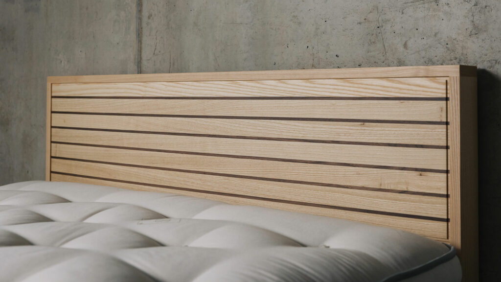 A special edition Leith bed in Ash wood with walnut stripes to the headboard panel