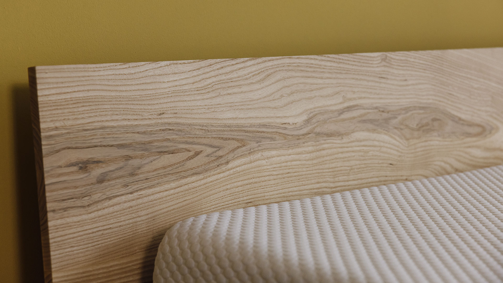 Close up of solid ash headboard on the Oregon bed frame.