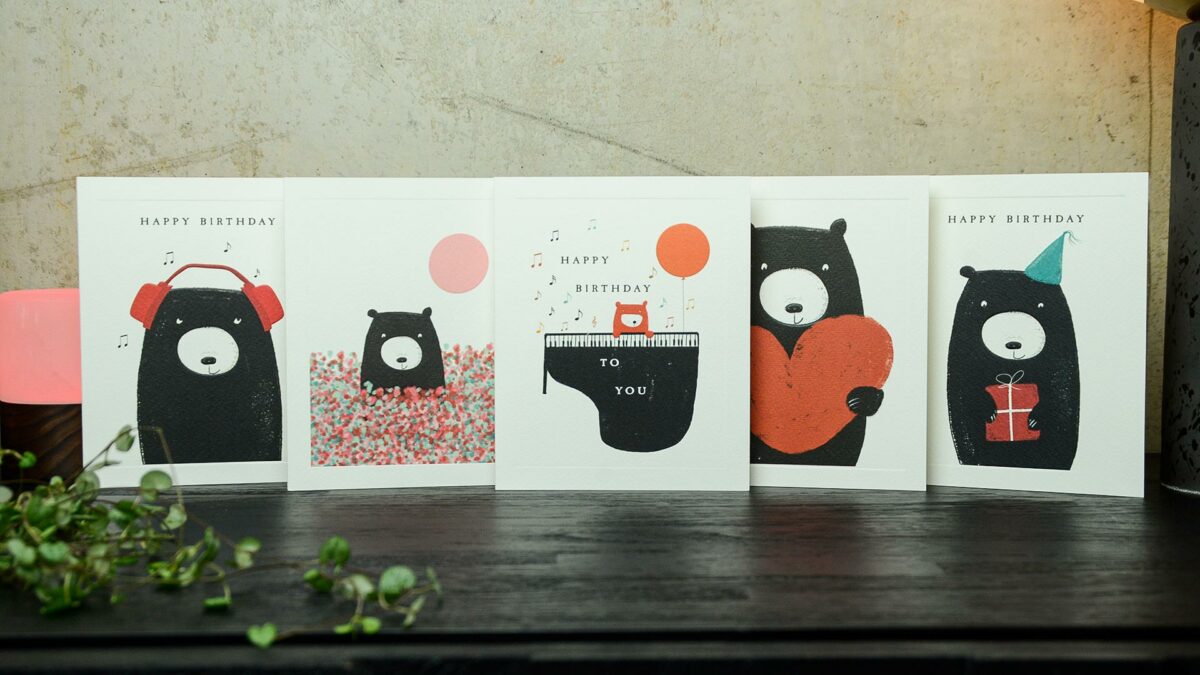 set of cards featuring a bear in the designs
