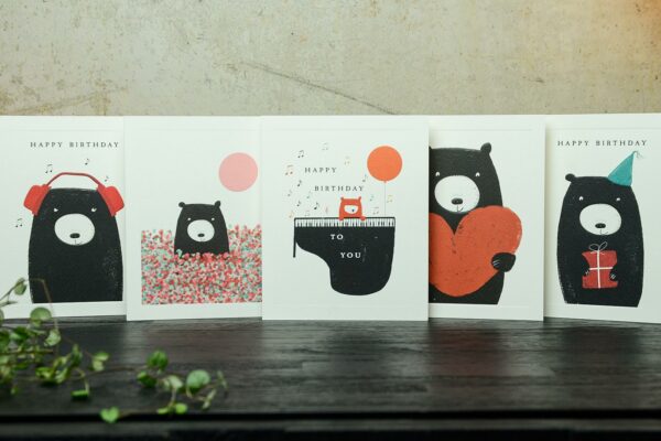 set of cards featuring a bear in the designs