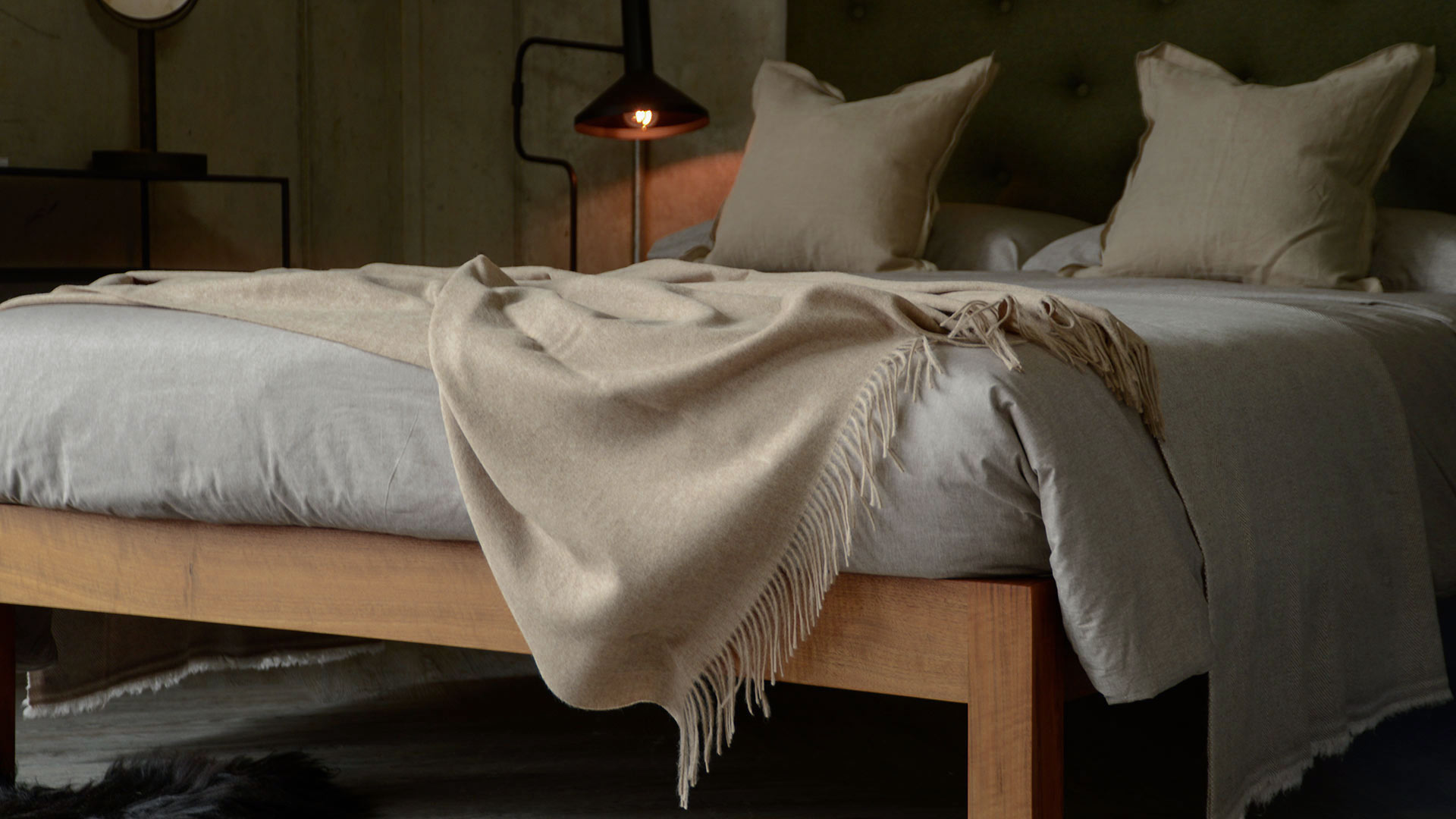 soft recycled wool fringed throw in pale beige