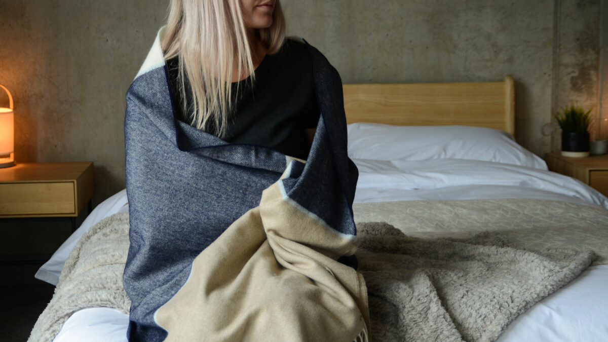 beige and blue throw