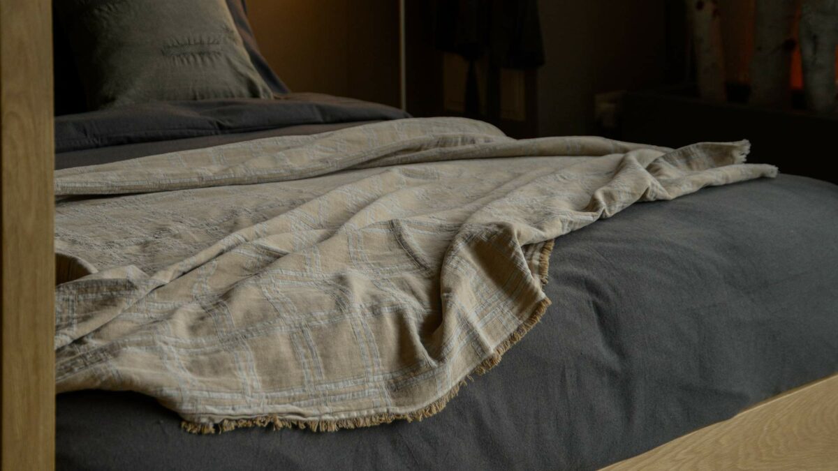 beige and grey reversible throw