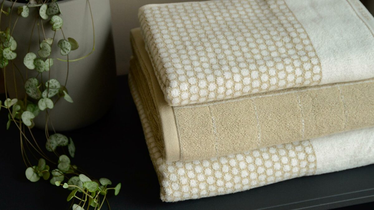 reversible patterned towels in beige and white