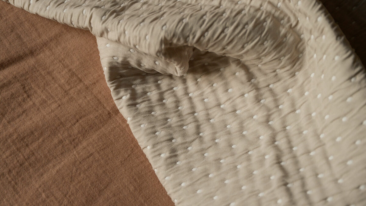 beige bedspread detail