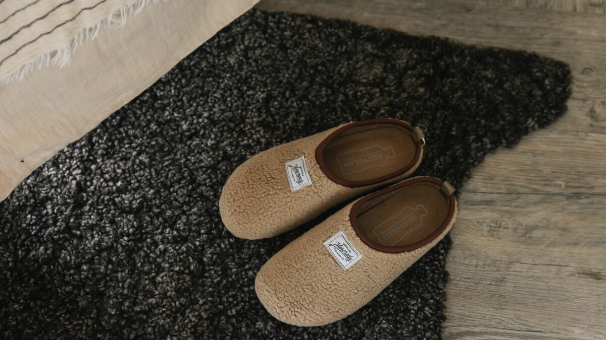 beige fleecy slippers made from recycled materials