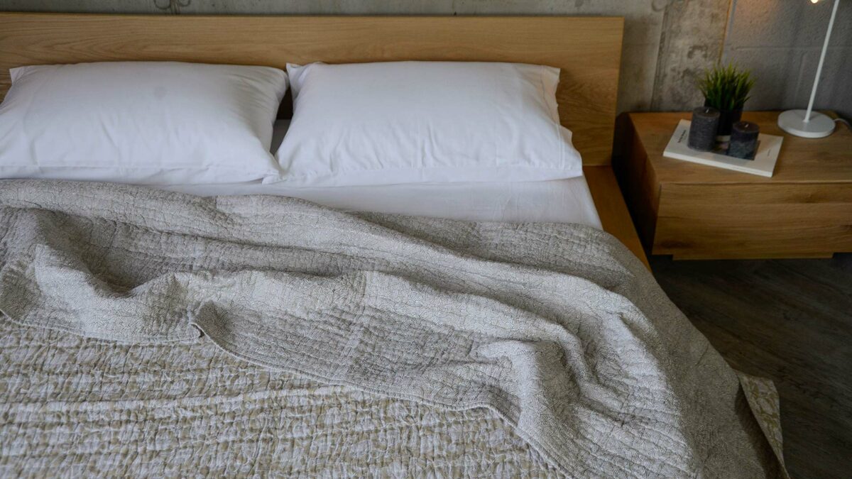 block printed reversible light quilt in beige and white