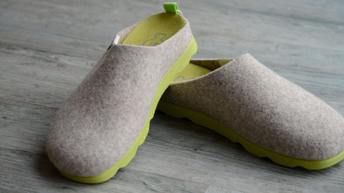 beige felt look slippers with chunky lime green soles sustainably made from recycled bottles