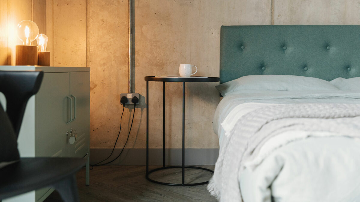 black Ethnicraft bedside table with Arran bed