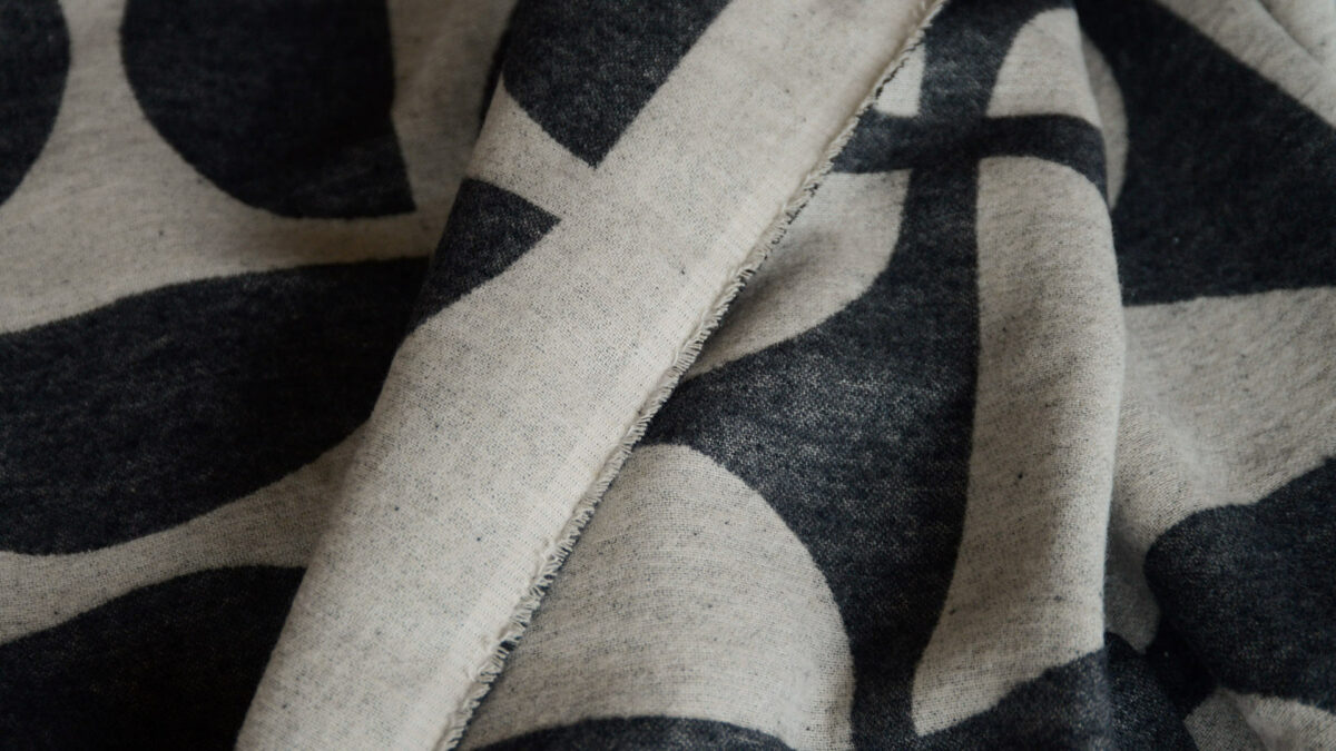 graphic patterned soft cotton throw in black and ecru