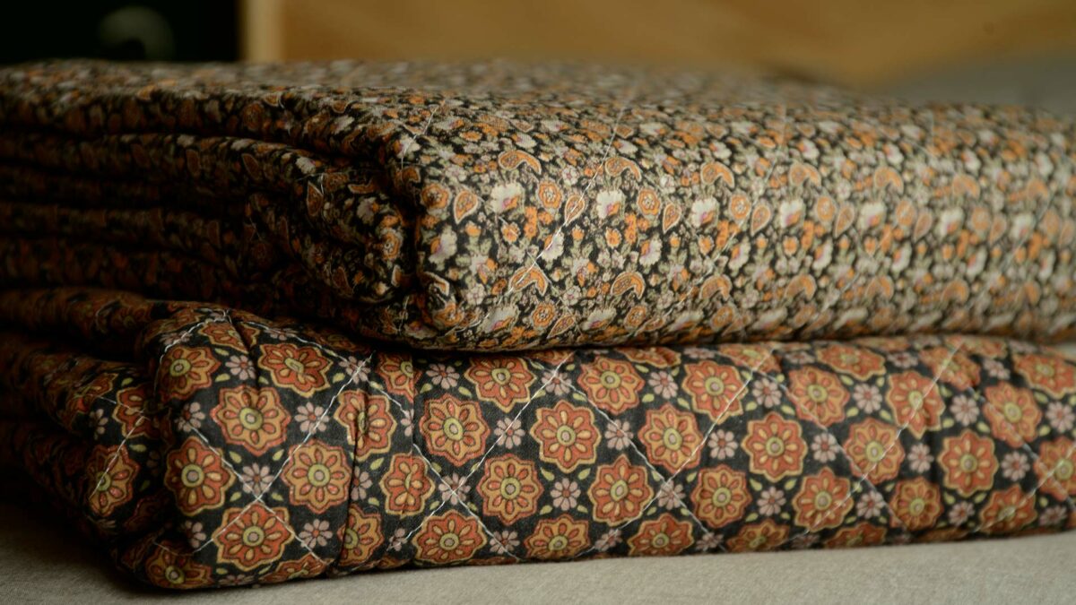 black and orange printed throws