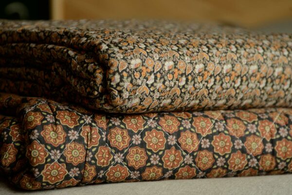 black and orange printed throws