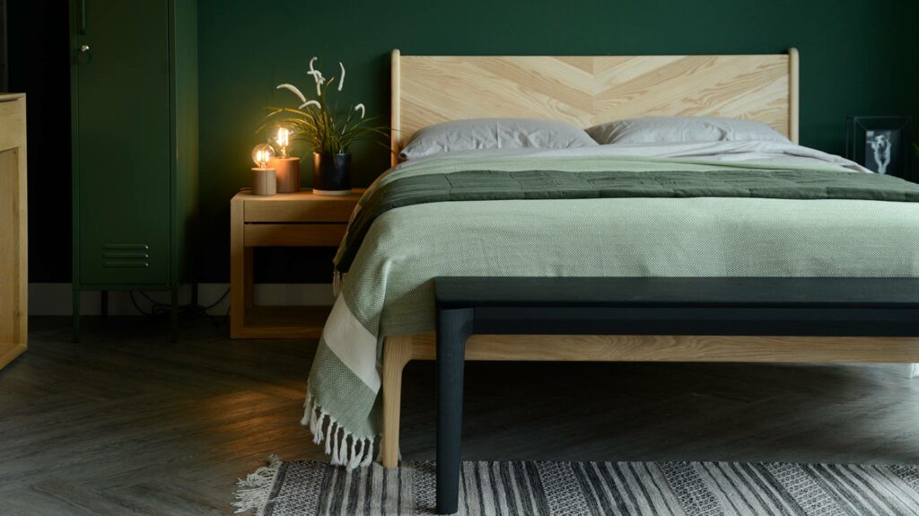 black painted solid oak bench or end of bed table shown in a bedroom