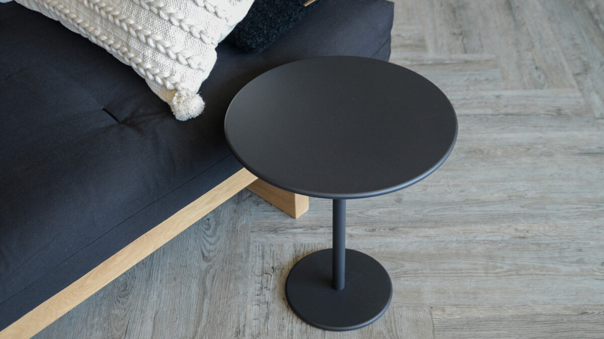 black circular side table with kyoto daybed from above