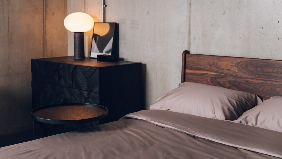 black drawers with side table and walnut camden with mink sateen bedding