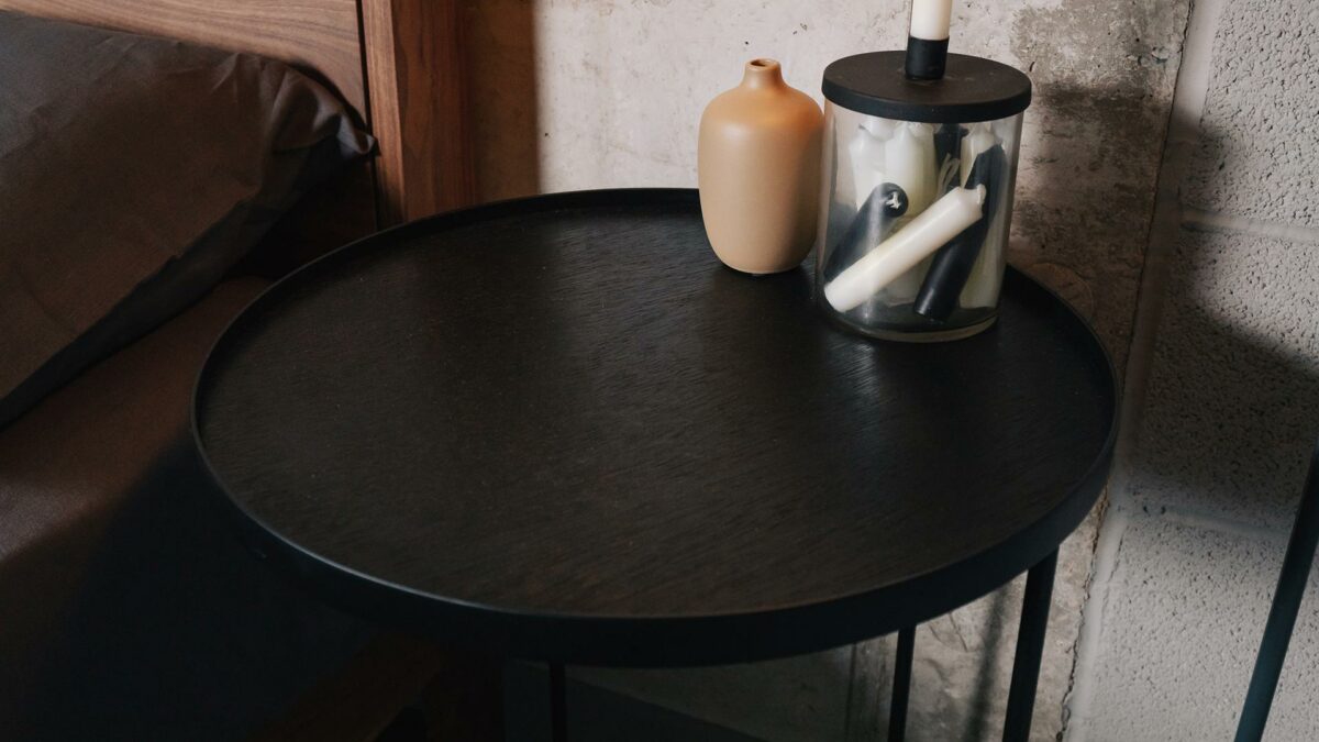 circular top of the black side table by Ethnicraft