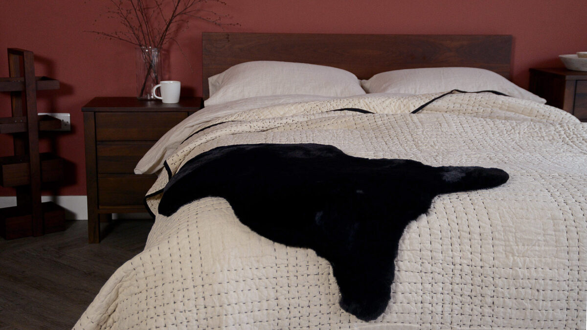 black faux sheepskin rug