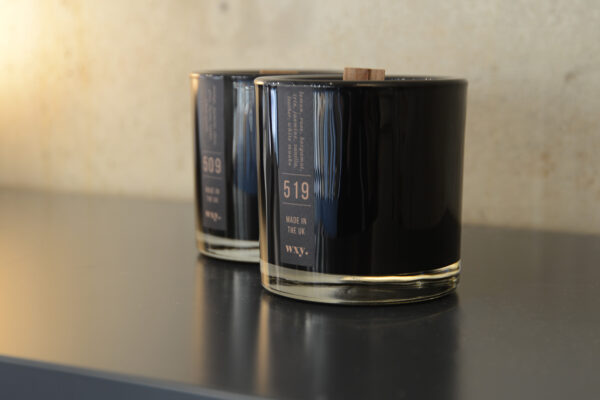 Black wax woodwick scented candles in sophisticated black glass jars