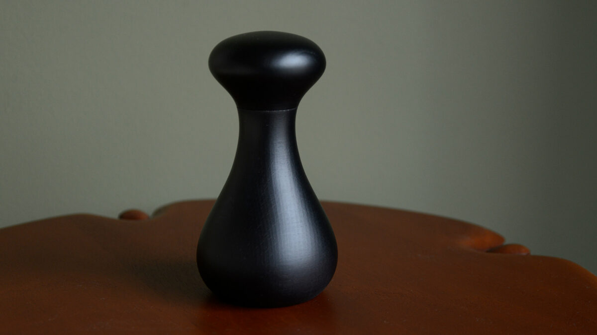 black lacquered wooden grinder