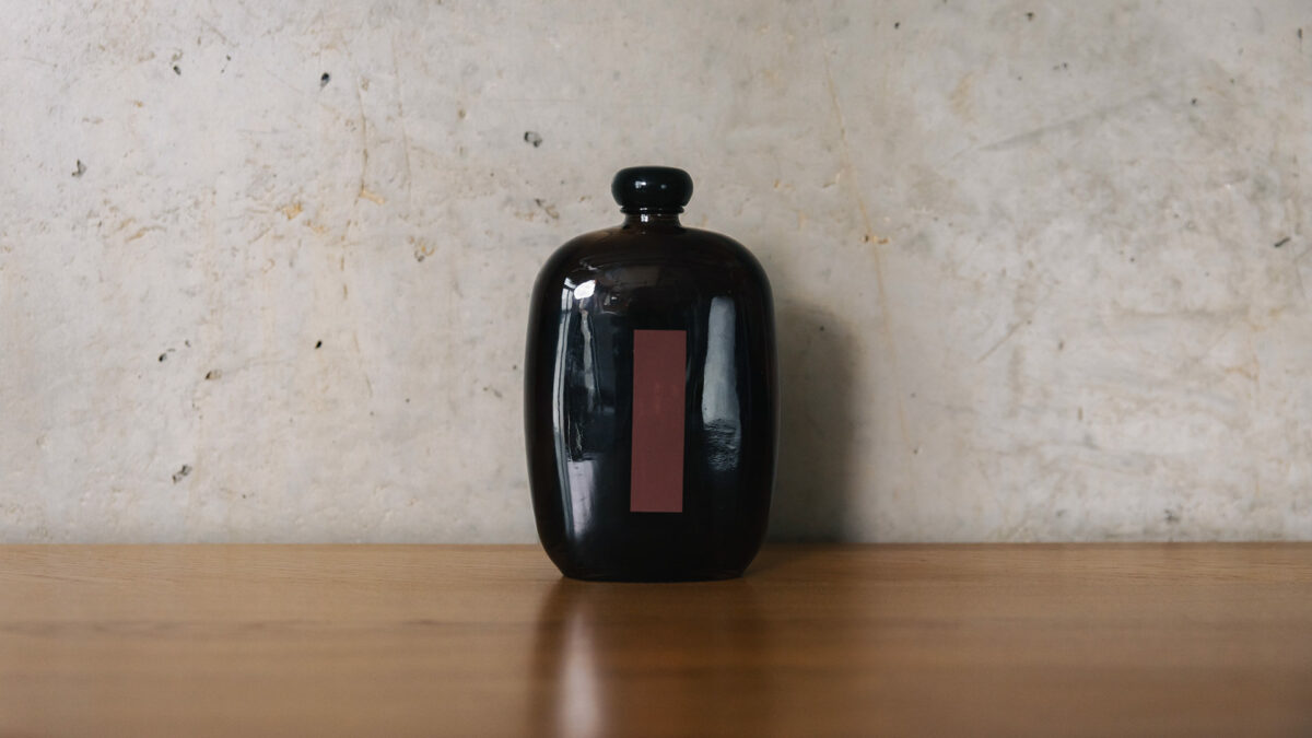 black matches in bottle with strike paper