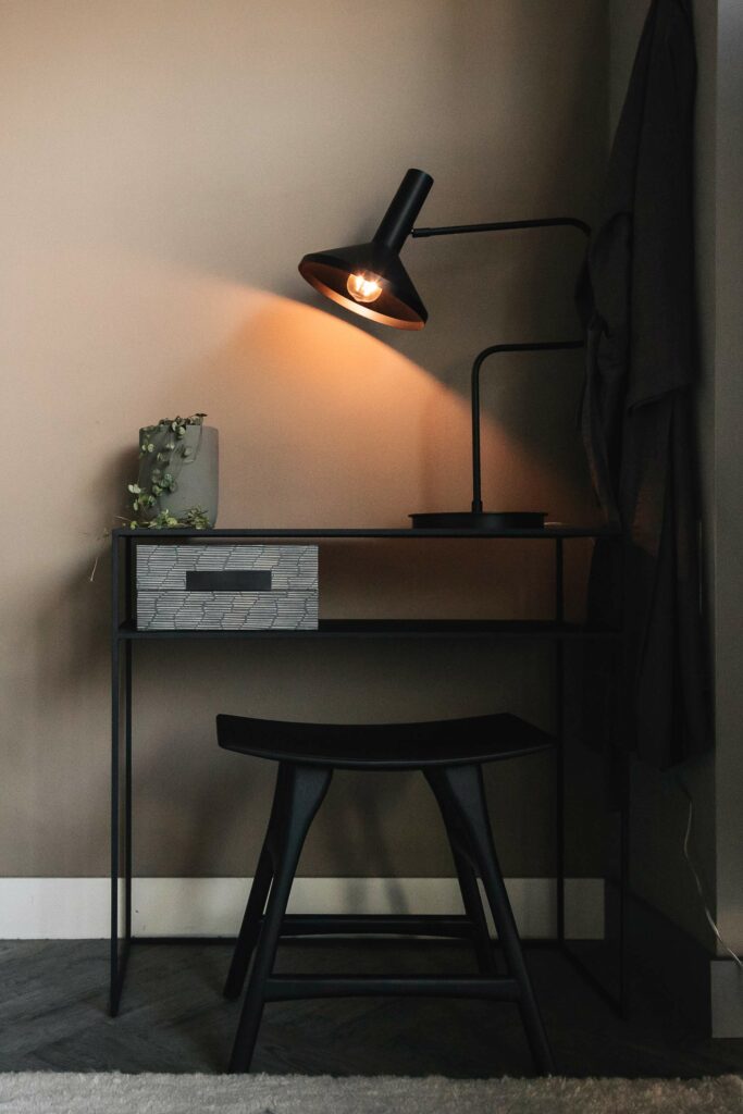 slim black metal side table shown with storage box and Box black wooden stool