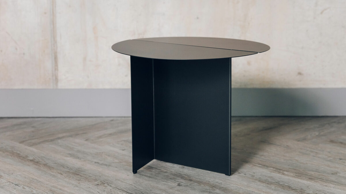 Bauhaus style black metal table with slotted circular top