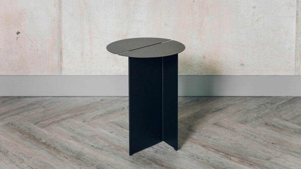 Bauhaus style black metal table with slotted circular top