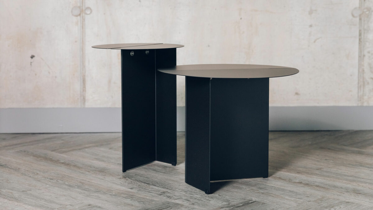 Bauhaus style black metal tables with slotted circular tops and in 2 sizes