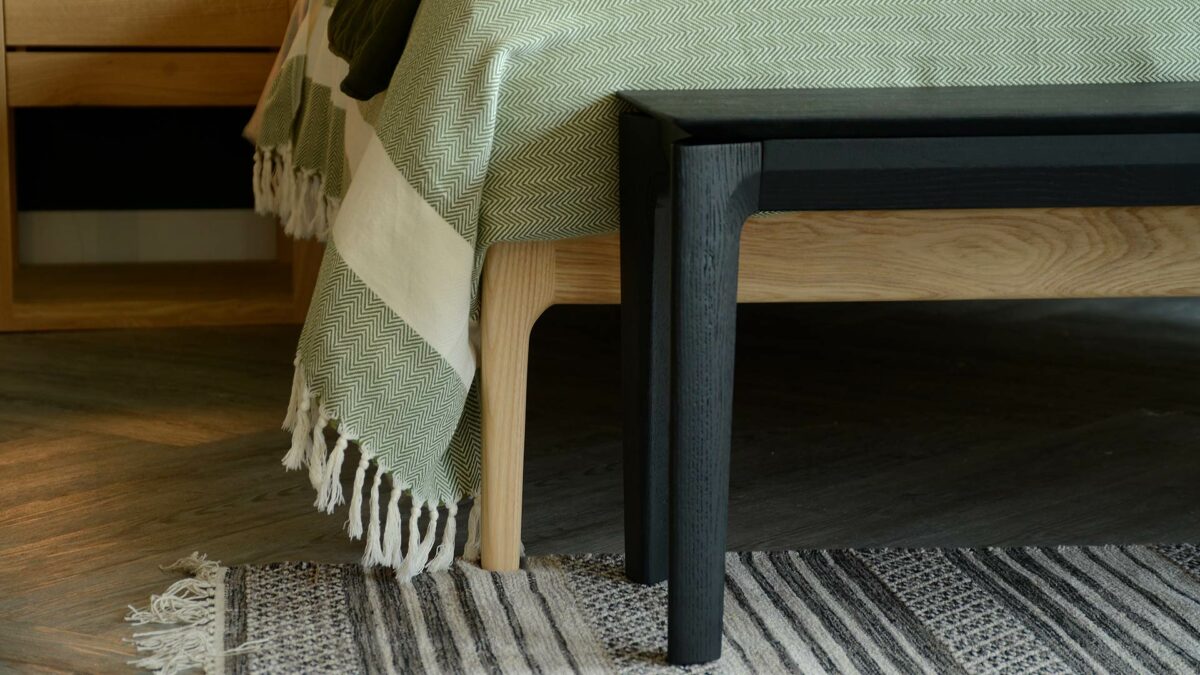 black painted solid oak bench or end of bed table a detail view