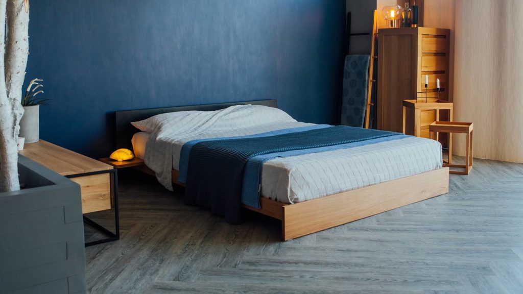 Our Oak Kulu low platform bed has a contrasting black-painted headboard.