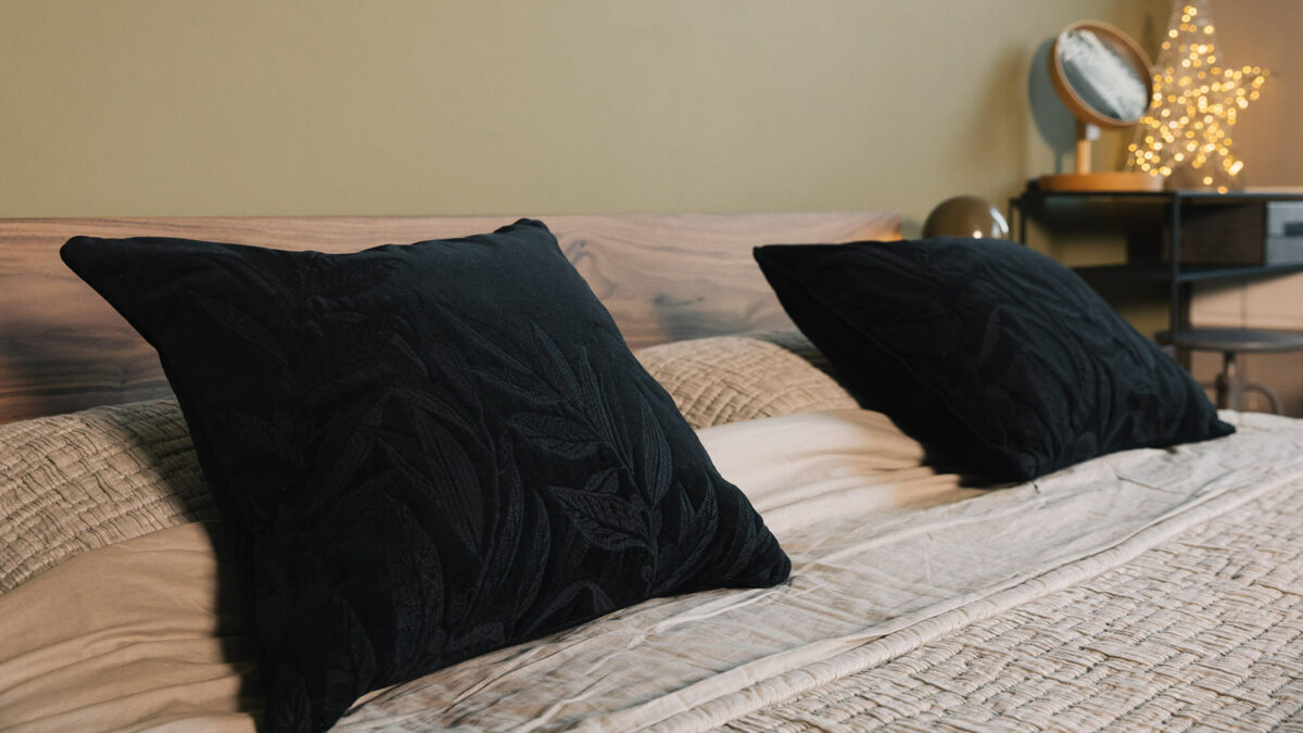 black velvet cushions with embroidered leaves design