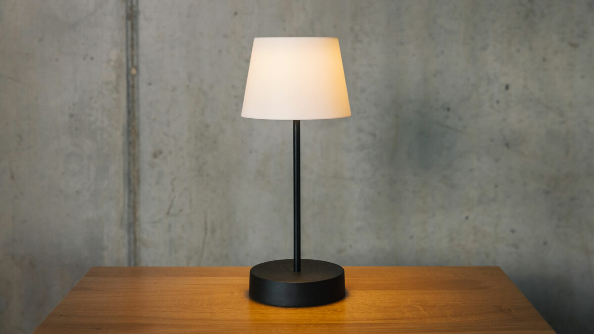 wireless lamp with a black base and a white shade