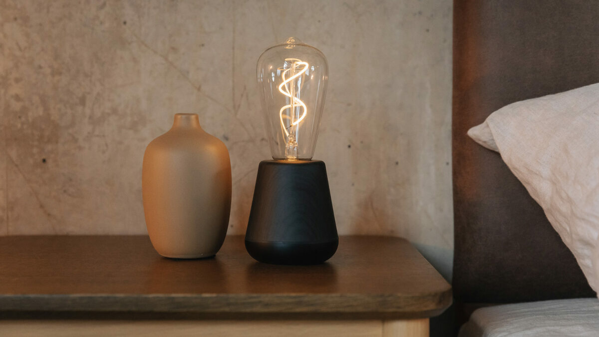 chargeable and portable modern bulb light in black stained wood with a black metallic base