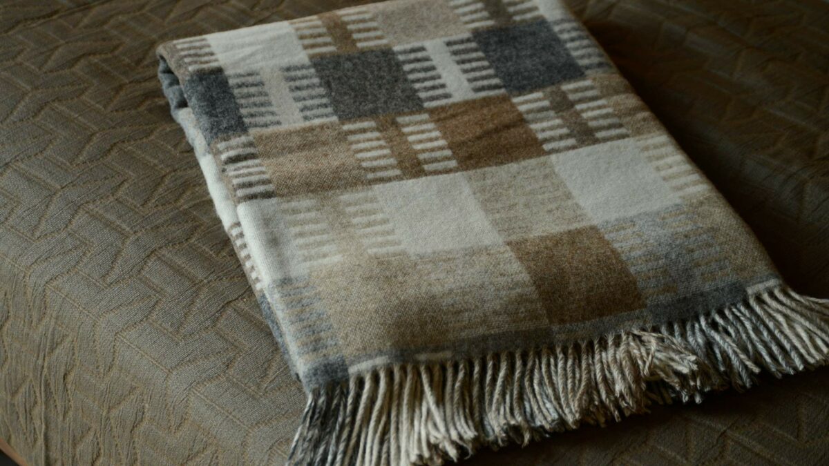 Patterned Merino wool throw in neutral colours