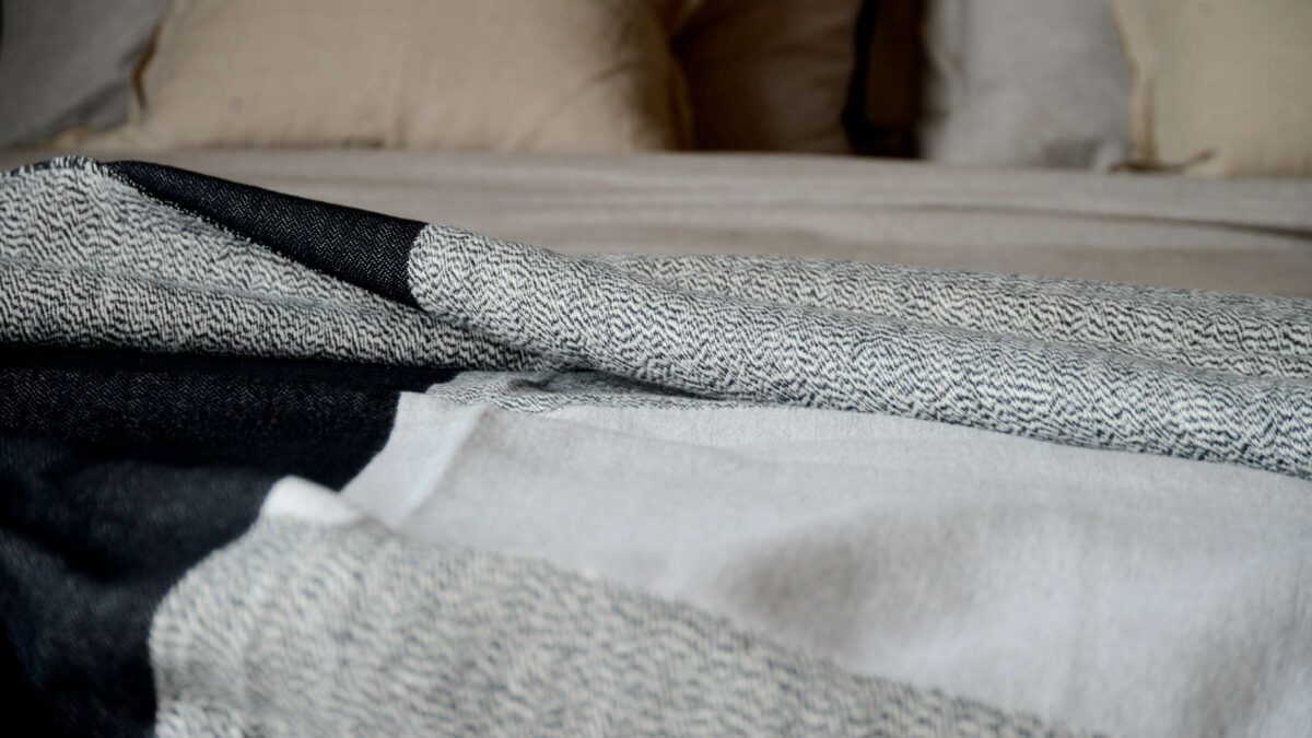 soft cotton monochrome woven design throw or blanket a closer view